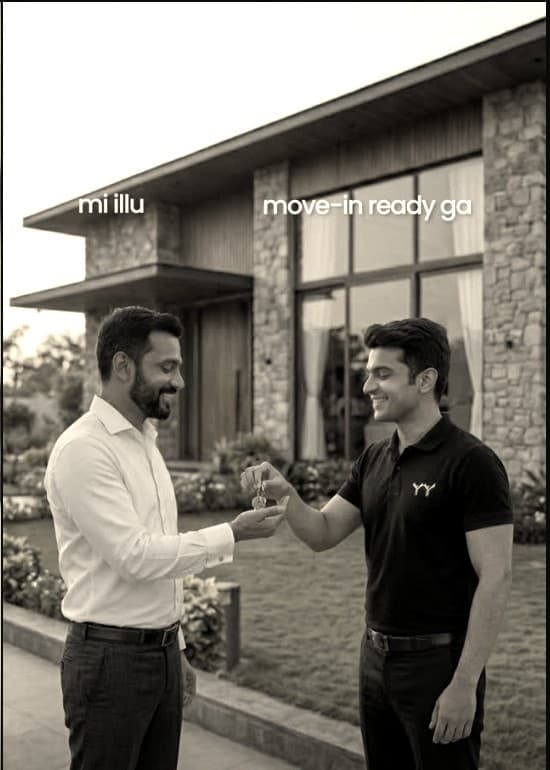 Handing over keys to a client outside a completed villa at dusk